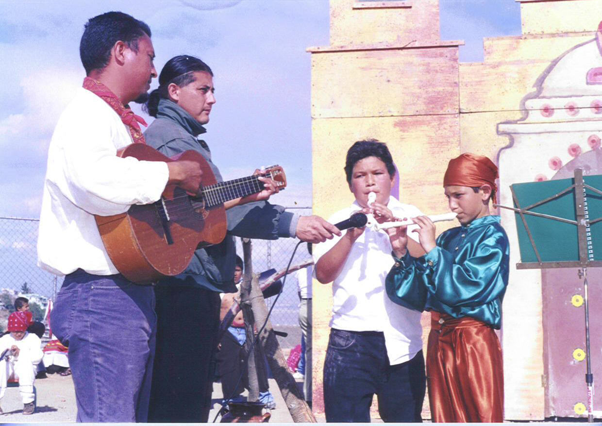 Colegio La Esperanza teachers Victor Esparza and Josue Gonzalez playing music with COlegio la Esperanza students