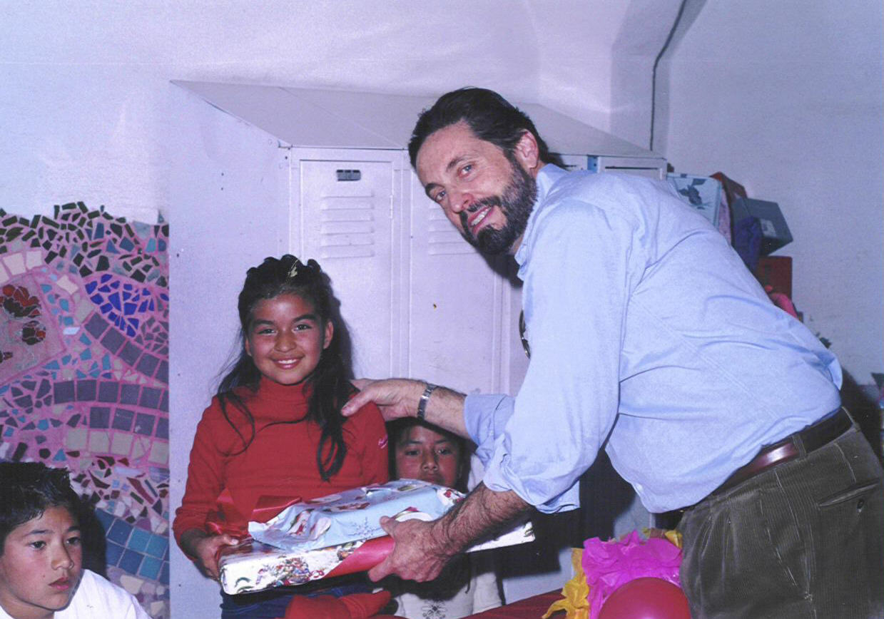 Peter_Calderon_Princeton Class of 1965 helps with Gift giving at Colegio La Esperanza